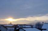 Foto: Tegelberg im Dunst, die Sonne scheint durch deine Wolkenlücke